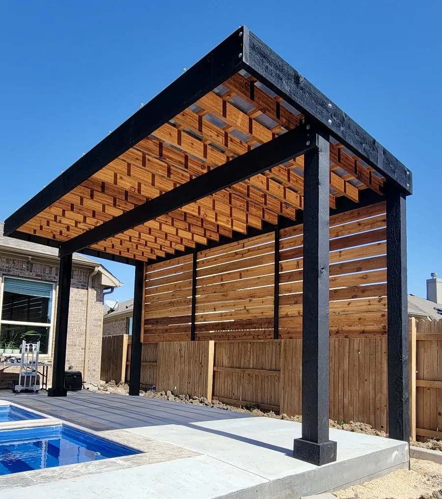 Modern two-tone stained pergola with a cedar privacy wall