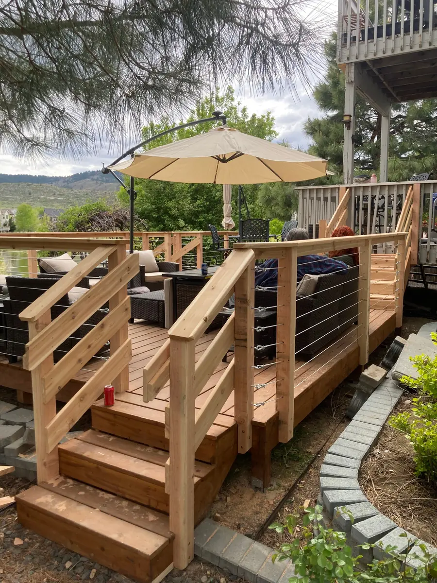 Cedar deck with stairs and cable railing overlooking the foothills