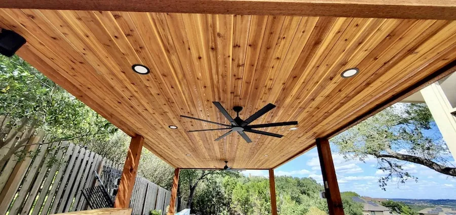 Cedar tongue and groove ceiling with fan and recessed lighting