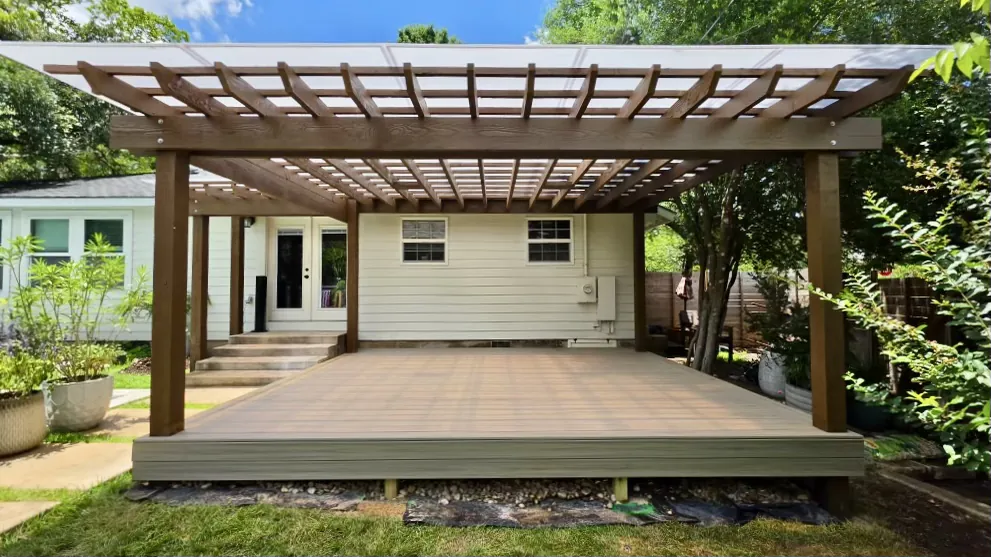 Clear polycarbonate roof on a cedar pergola over a composite deck