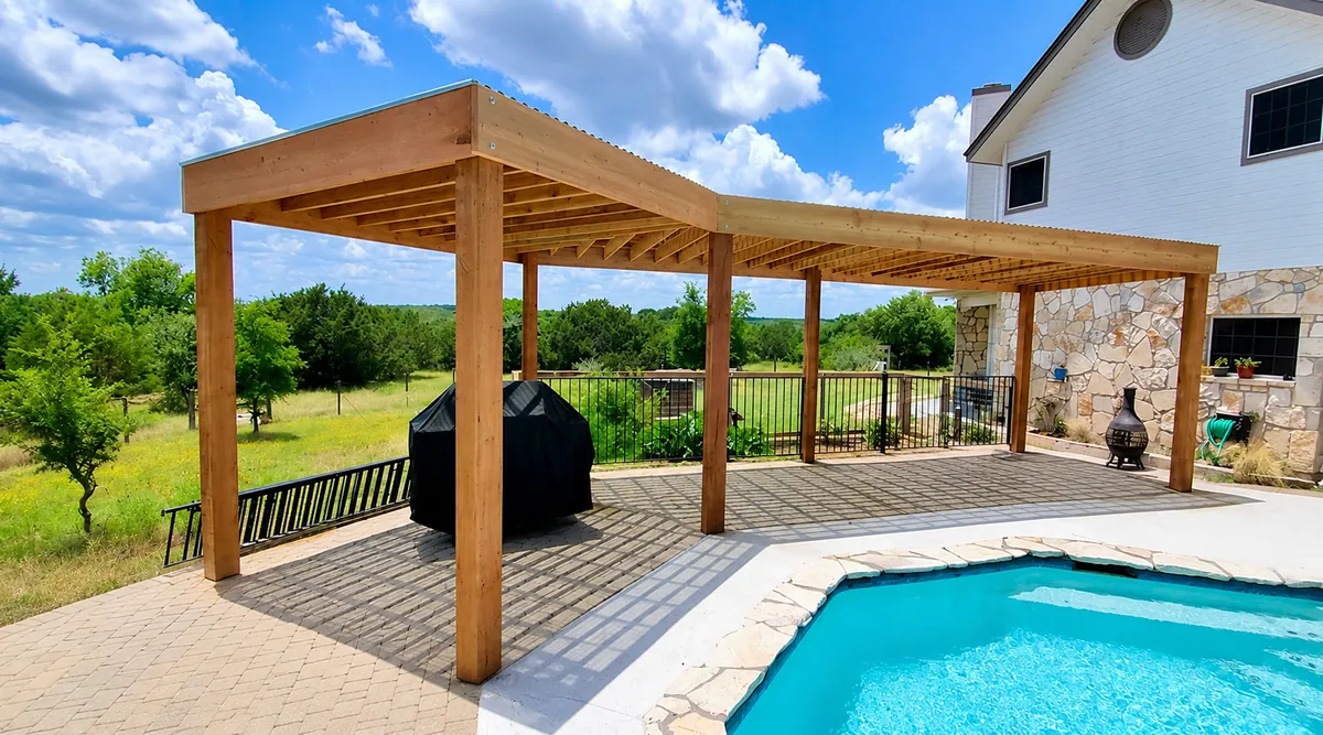 Large custom-shape modern cedar pergola alongside a pool with a bent roofline following the patio
