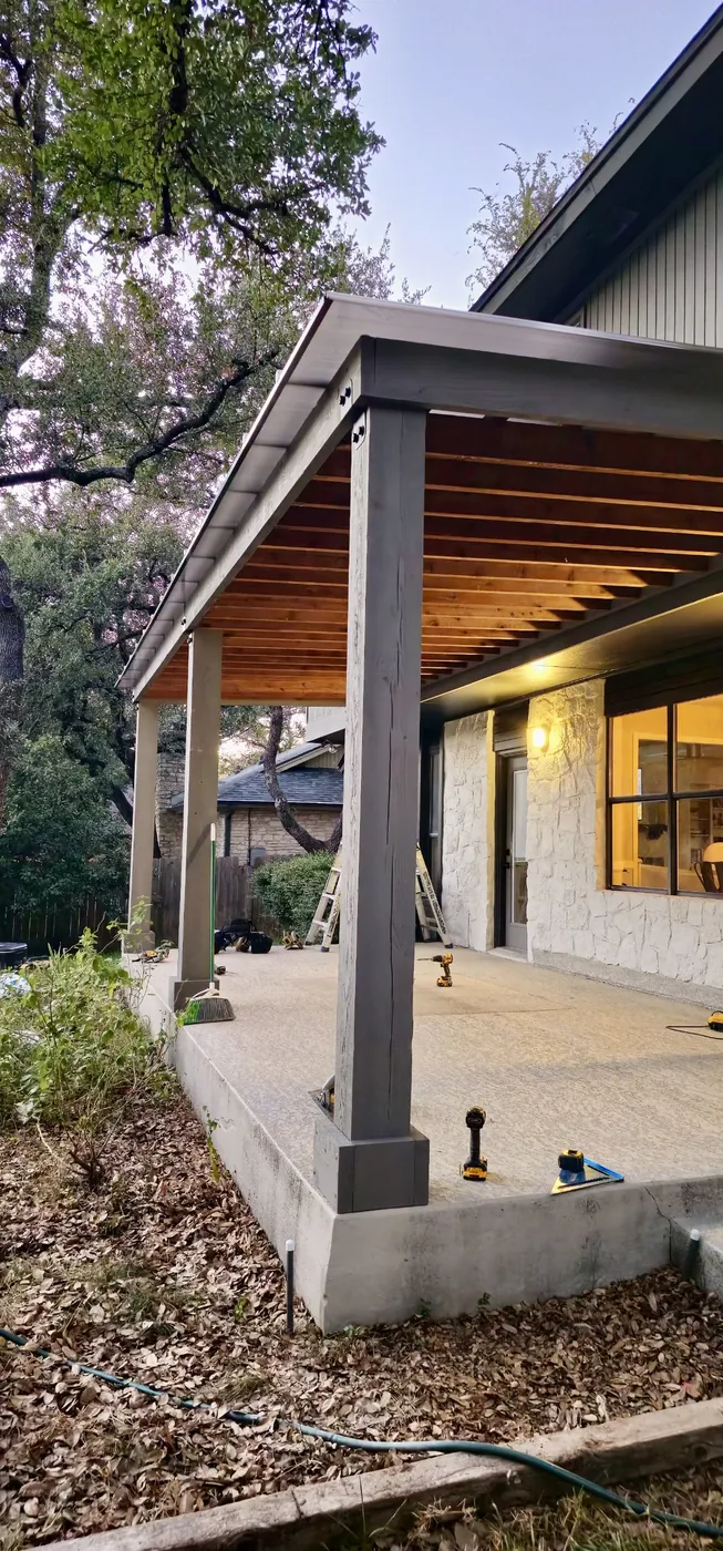 Ice white Hercules roof over stained cedar rafters on an attached patio cover