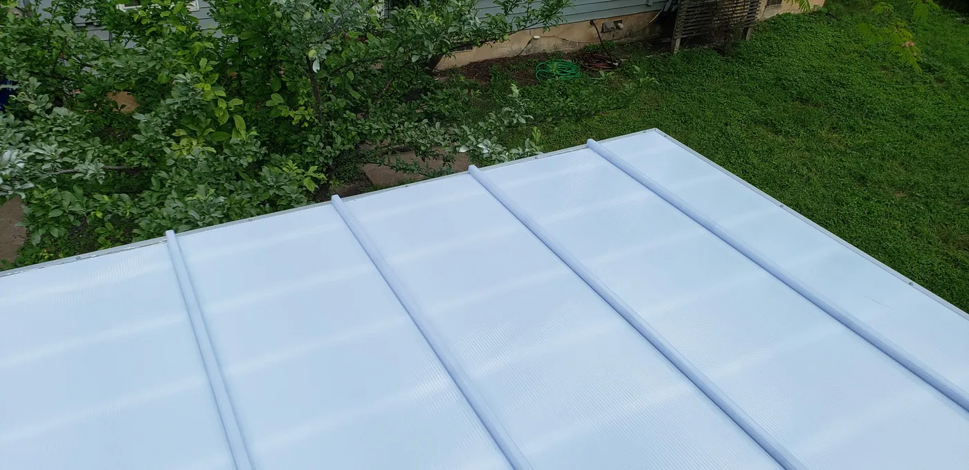 Aerial view of an ice white polycarbonate pergola roof