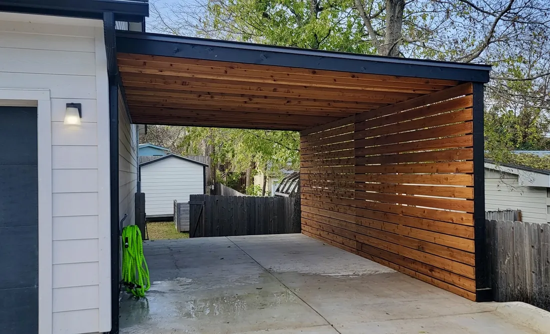 Modern-style attached cedar carport with a two-tone stain