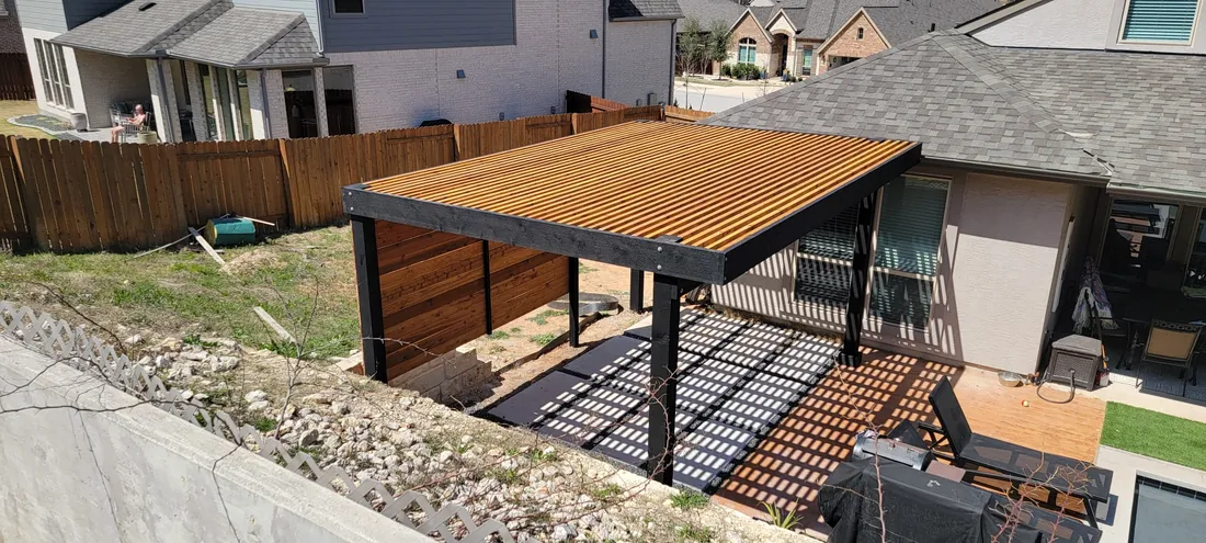 Aerial view of a modern two-tone stained pergola with 2-inch top slat spacing