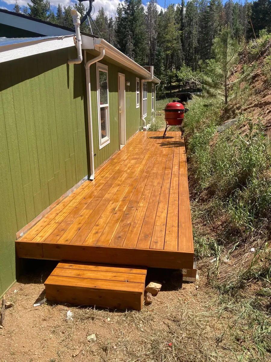 Narrow deck built along a hillside home in the Colorado mountains